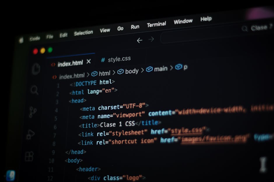 A close-up view of a computer screen displaying lines of HTML and CSS code in a text editor, with a focus on the tags and attributes used for web development. The code includes elements such as <html>